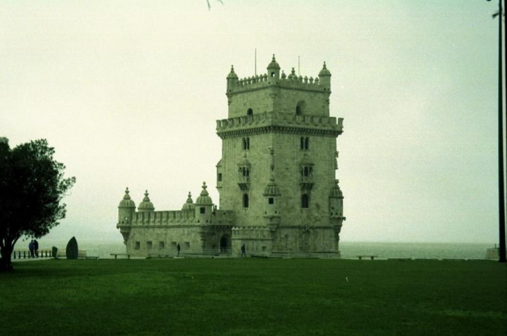 This is the Torre de Belem (in the pouring rain - we're hiding under a big tree).  It was built from 1515 to 1520 as a harbour fortress.  It originally sat directly on the shoreline, but thanks to the receding waters, a short bridge gets you there.