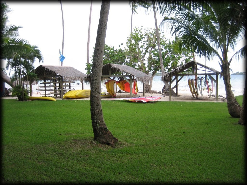 Kayaks and windsurfers next to the sailing shack.