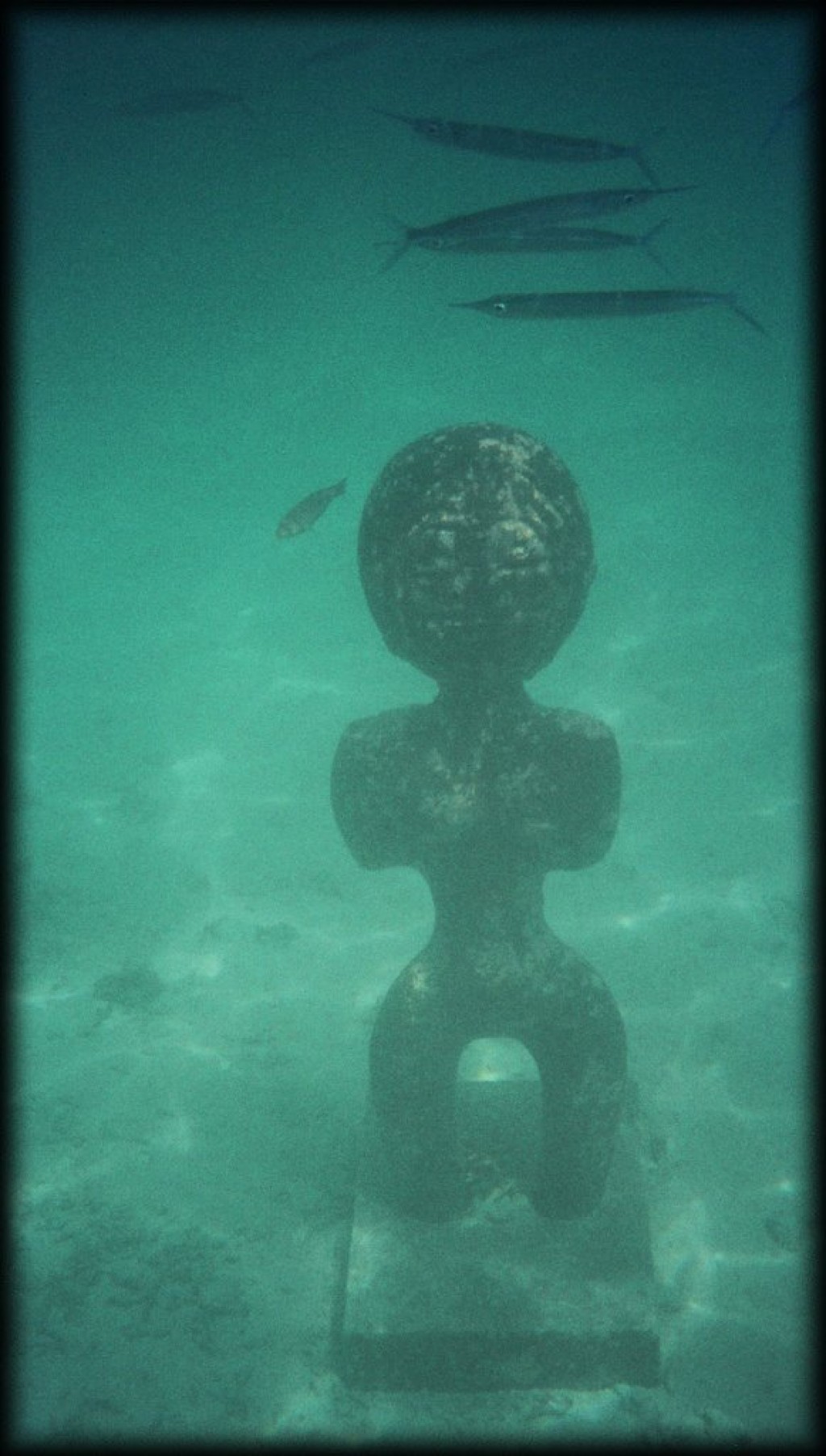Tiki statue underwater at Club Med Pier.