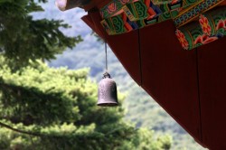 Bell hanging from one of the temple buildings.