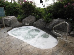 Hot tub / Whirlpool - notice beer cans litter at corner.  This is the sight we got when we first arrived one morning - they didn't clean it overnight.