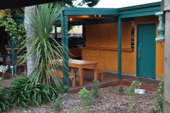 Covered outdoor patio seating at The Secret Garden restaurant, Blenheim, New Zealand 