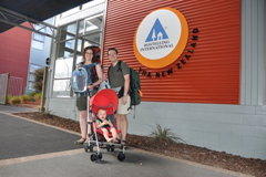 The three of us in front of our first hostel in Rotorua, New Zealand.  Diaper backpack on front, backpack with Phil&Teds Traveler and everything else on back, baby in the UppaBaby G-Lite and we're ready to go!