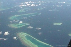 The amazing atolls of the Maldives stretch out to the horizon as you fly into the capital city of Mali.