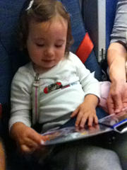 Two years later, and still absorbed in her Sassy photo book.  Truly a great travel toy that will "grow" with your child!