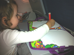 Keeping busy on the flight with the Travel Aquadoodle - a great toddler travel toy!