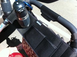 The UPPAbaby Vista Parent Organizer fits a thermos water bottle and the middle pocket is the perfect size for an iPhone.